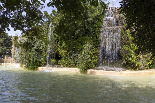 Beautiful natural park with several waterfalls, The Ornamental Pond in Genovés Botanic Gardens Cadiz, Andalusia Spain