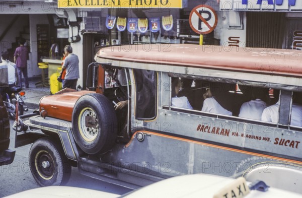Jeepney, minibus in heavy traffic with nuns as passengers, Manila in 1995, Philippines