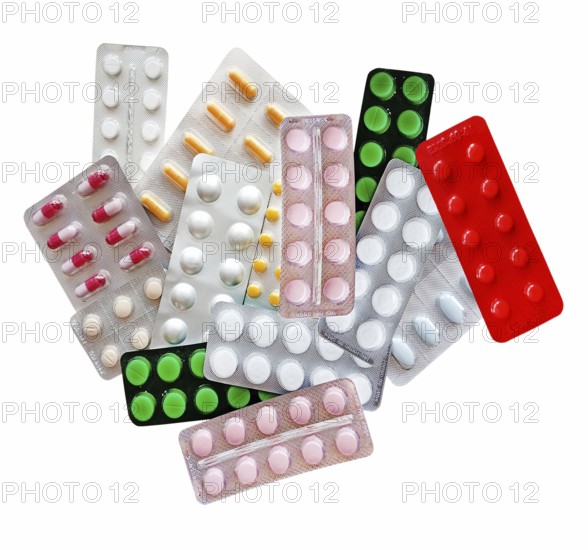 Medicines in the form of multi-colored tablets in blisters on a white background