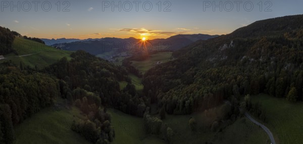 Sunset between the first and second Jura ranges, drone shot, Breitehöchi, Mümliswil, Solothurn, Switzerland