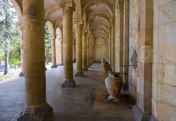 Spacious portico with jugs and symmetrical stone arches that combine historical flair with natural light, mineral water gallery in Jermuk, Jermuk, mineral springs, health resort, Wajoz Dzor province, Armenia