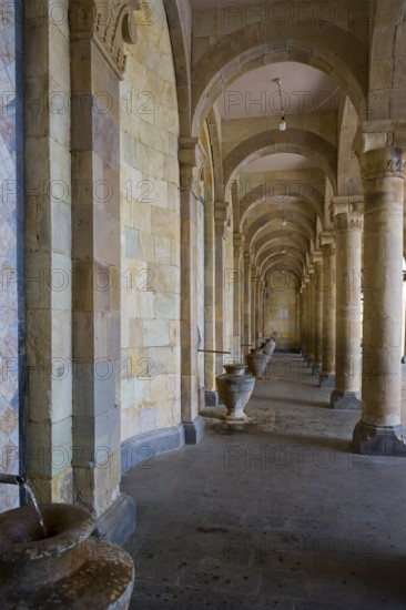 Long portico with stone arches and jugs that offer a perspective into the depths and reflect a historical aura, mineral water gallery in Jermuk, Jermuk, mineral springs, health resort, Wajoz Dzor province, Vayots Dzor, Armenia