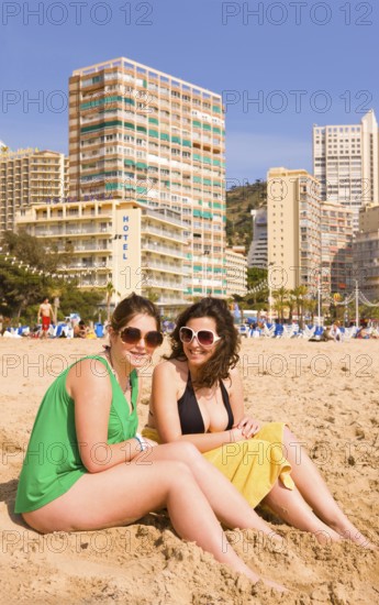 Two woman on the beach, Benidorm, Valencia (region), Costa Blanca, Spain