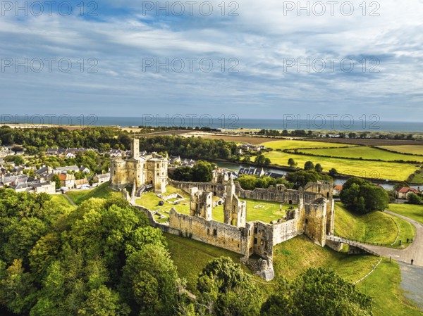 Warkworth Castle over River Coquet from a drone, Warkworth, Northumberland, England, United Kingdom