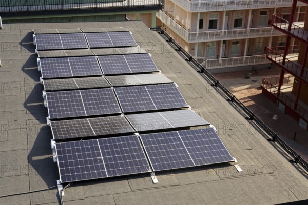 Solar panels on roof of apartment building, renewable green sustainable energy concept, water cooling, aerial view, Gothenburg, Sweden