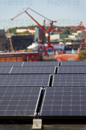 Solar panels on roof of apartment building, renewable green sustainable energy concept, water cooling, aerial view, Gothenburg, Sweden