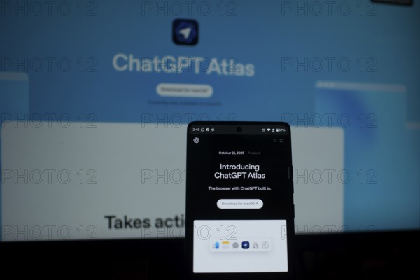 A smartphone showing ChatGPT Atlas with a bright blue background
