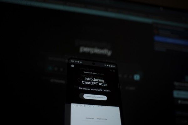 Dimly lit smartphone screen showing ChatGPT Atlas details