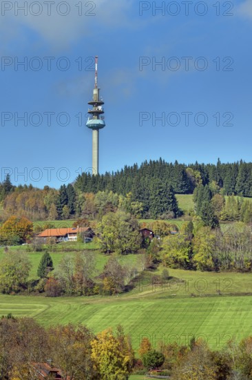 Blue sky with clouds, mixed forest, meadows and farm, Berg Blender with telecommunications tower near Kempten, Swabia, Bavaria, Germany
