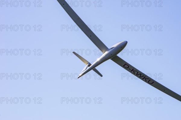 A Schempp-Hirth Arcus E motor glider, registration D-KWKU, during a screening as part of an air show at the Fliegerbergfest of the Rossfeld Luftsportverein in Metzingen-Glems, Baden-Württemberg, Germany, for editorial use only