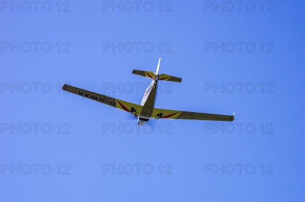 A Moravan Zlin Z-526 aerobatic aircraft, registration D-EWXA, during a demonstration as part of an air show at the Rossfeld Air Sports Association on Rossfeld in Metzingen-Glems, Baden-Württemberg, Germany, for editorial use only