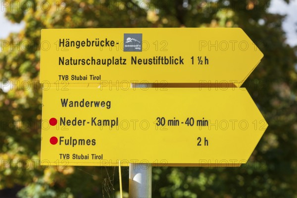 Yellow signs for hiking trails, Neustift im Stubai Valley, Stubai Valley, Tyrol, Austria