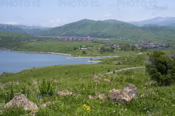 Wide view of a lake surrounded by green hills and mountains under a blue sky, Kechut, Kushchi, Kush-Bilyak, and Kechut Reservoir, Wajoz Dzor Province, Vayots Dzor, Armenia