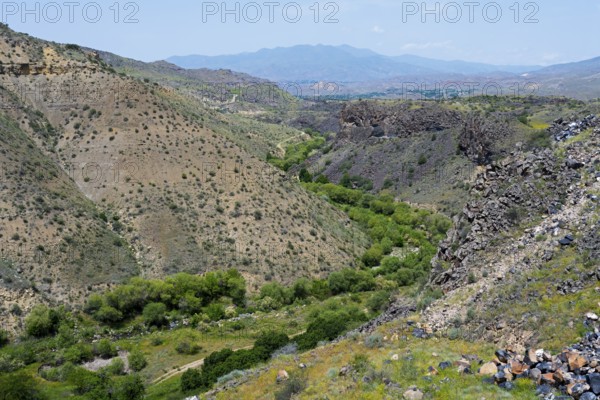 Landscape of hills and green trees with a rocky gorge, Arpa River valley near Vayk, Vayots Dzor province, Vayots Dzor, Armenia