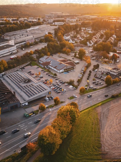 Aerial view of a city at sunset with autumn colors and a mountainous landscape, Calw, Black Forest, Germany