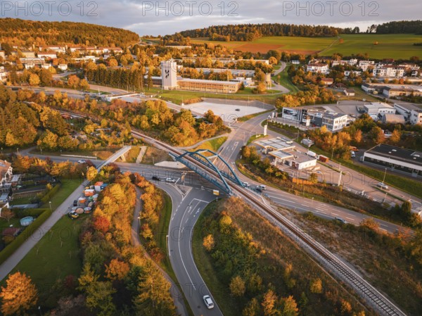 Autumn view of a road network with bridge over railroad tracks of the Hermann Hessebahn, Calw, Black Forest, Germany