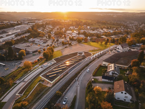 Bird's eye view of a village at sunset with Hermann Hessebahn rails in the foreground, Calw, Black Forest, Germany
