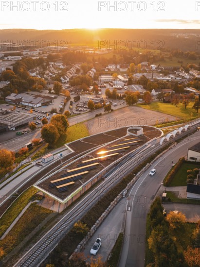 Aerial view of Hermann Hesse Bahn Heumaden station, at sunset with rails in the foreground, Calw, Black Forest, Germany