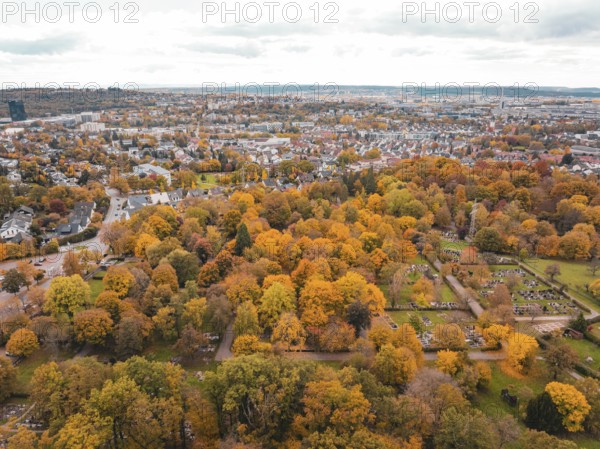 Extensive view of city and autumn park with intensely coloured vegetation, Sindelfingen, Böblingen district, Germany