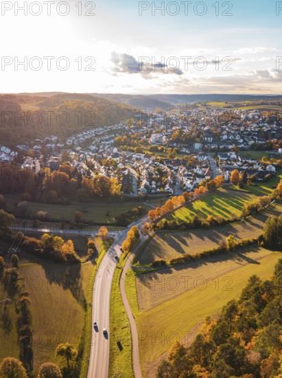 A road-encircled village nestled in a colorful autumn landscape, Aidlingen, Böblingen district, Germany