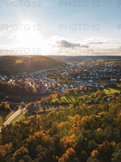 Autumn landscape with a small village surrounded by colorful trees, Aidlingen, Böblingen district, Germany