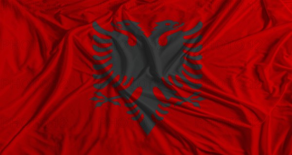Albanian flag with fabric texture background. National flag of Albania with cloth texture