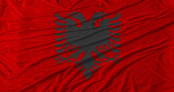 Albanian flag waving. Flag of Albania with cloth texture