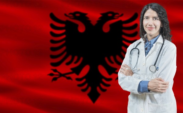 Albanian medicine and healthcare concept. Close up of doctor against Albania flag background