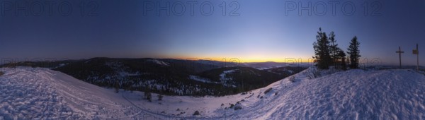View from Mount Lusen over the hills of the bavarian forest at sunrise in winter, Bavaria, Germany