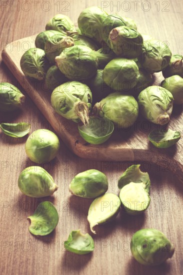 Fresh Brussels sprouts, raw, top view, on a wooden table, no people