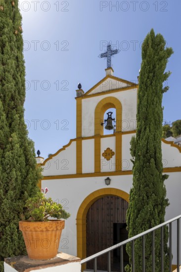 On the road to the white villages. Paths and narrow streets of a historic old town. Ermita de San Benito Church in Setenil de las Bodegas, Cadiz, Andalusia, Spain