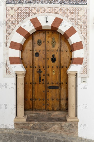 On the road to the white villages. Beautiful doors of the historic old town in Setenil de las Bodegas, Cadiz, Andalusia, Spain