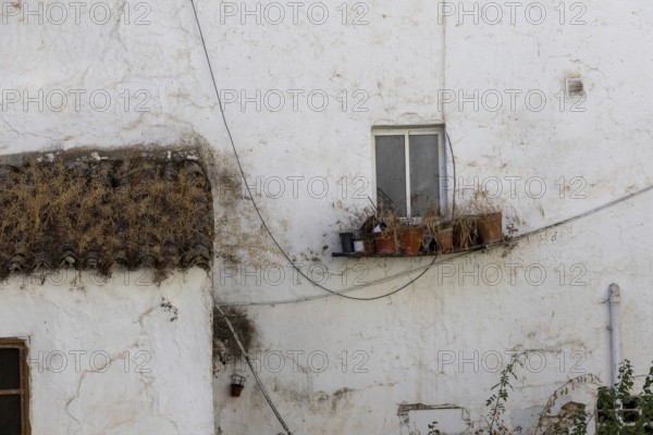 On the road to the white villages. Beautiful windows of the historic old town in Setenil de las Bodegas, Cadiz, Andalucia, Spain