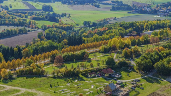 A picturesque view of an autumn landscape. Vivid trees, meadows and clear skies create a peaceful atmosphere in nature. Bad Neualbenreuth, Upper Palatinate