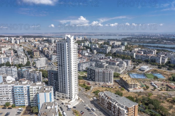 Aerial view of a city with tall buildings and roadways. Aerial view to the skyscraper in the Meden Rudnik district, Burgas, Bulgaria