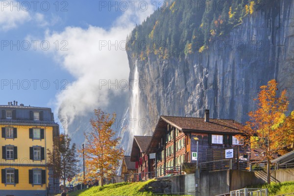 View of town with Staubbach waterfall in autumn, Lauterbrunnen, Bernese Oberland, Canton of Bern, Switzerland