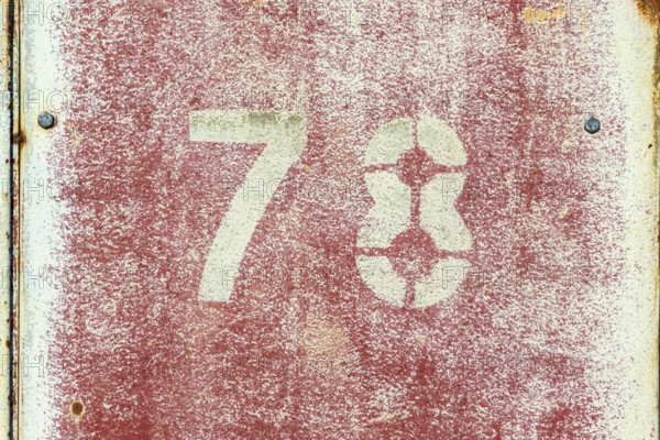 Number 78 on vintage rusty red and white metal sheet plate Prague, Czech republic