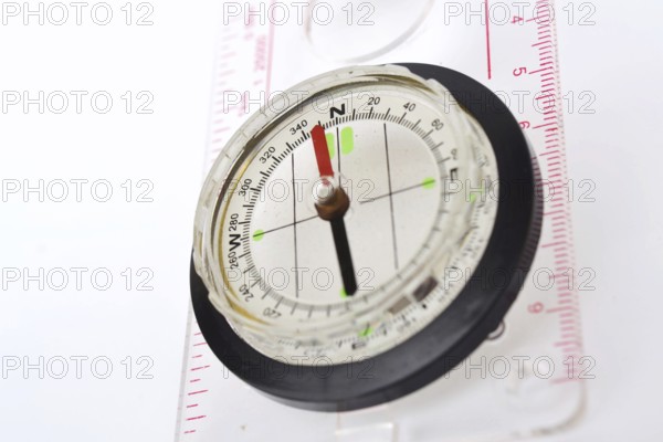 Detail shot of glass compass isolated on white background Prague Czech republic