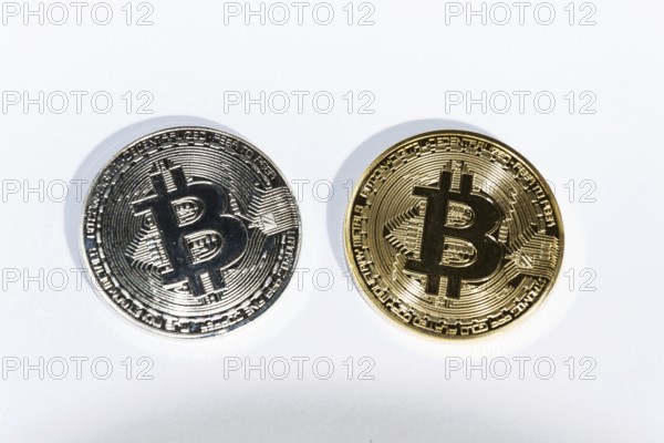 Pair of bitcoin coins isolated on white background, cryptocurrency investing Prague Czech republic