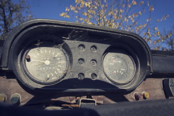 Filtered vintage photo of rusty speedometer on car control panel on sunny day Prague Czech republic
