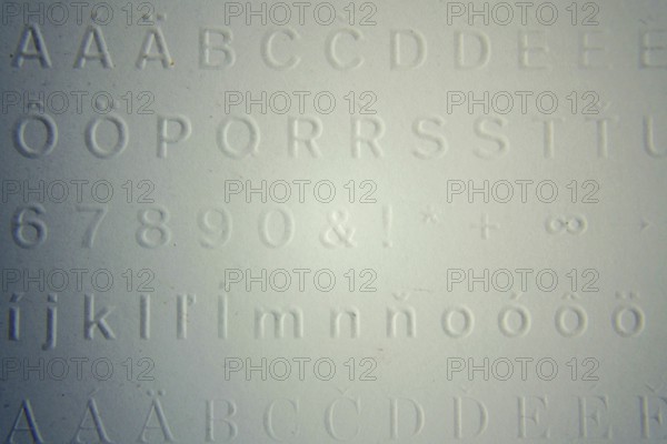 Embossed writing for blind people used before Braille writing system Prague, Czech republic