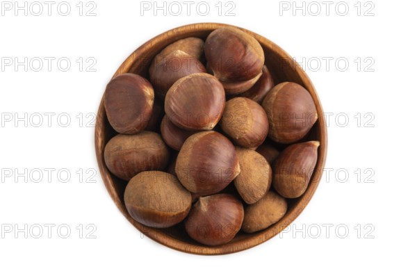 Wooden bowl with raw edible ?hestnuts Isolated on white background, top view, flat lay, close up, minimalism