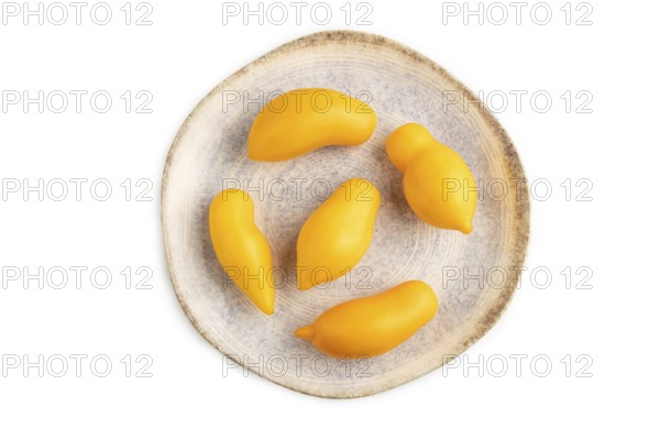 Yellow tomatoes on plate isolated on white background. Top view, flat lay, close up. healthy food, vegetable, minimalism