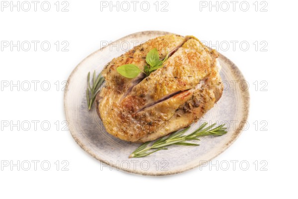 Fried Turkey Thigh with spices and rosemary on plate isolated on white background. side view, close up