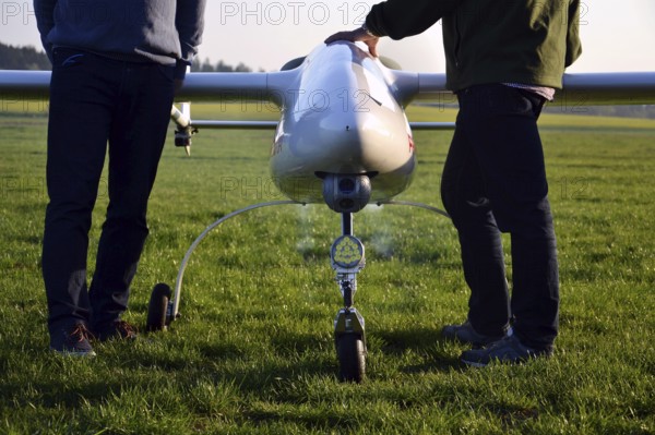 Man preparing unmanned aerial vehicle drone with light and camera Pisek Czech republic