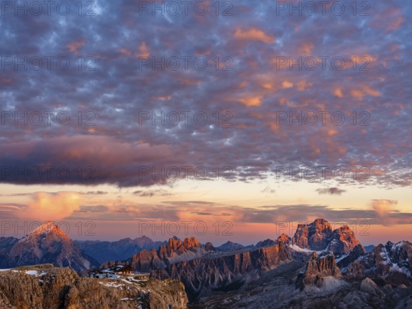 Alpenglühen, Rifugio Lagazuoi and rugged Dolomite peaks at sunset, Dolomites, Alps, Belluno province, Veneto, Italy