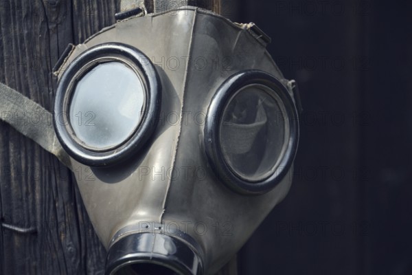 Closeup of a gas mask on a wooden background