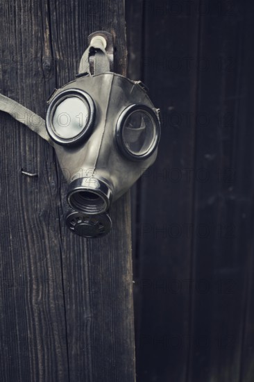 Closeup of a gas mask on a wooden background