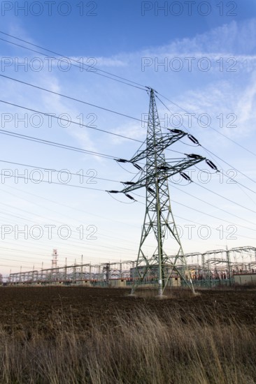Electricity pylon with dramatic cloudy sky vertical photo Prague Czech republic