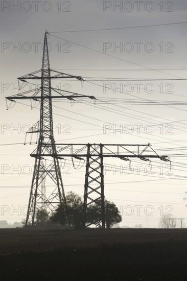 Electricity pylons leading from distribution power station Prague Czech republic